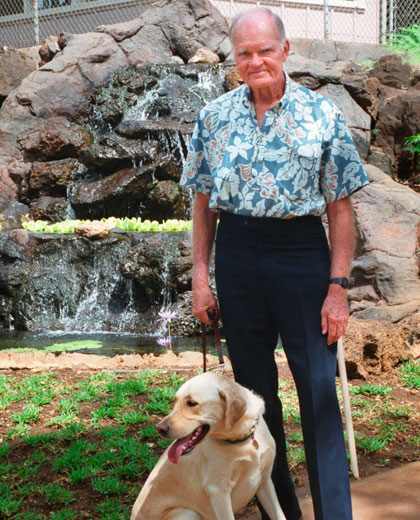Robert Midkiff and his dog Mickey attend the debut of a new waterfall feature at the Hawaiian Humane Society. The business executive and philanthropist died Wednesday at age 94. (STAR-ADVERTISER / 1999)
